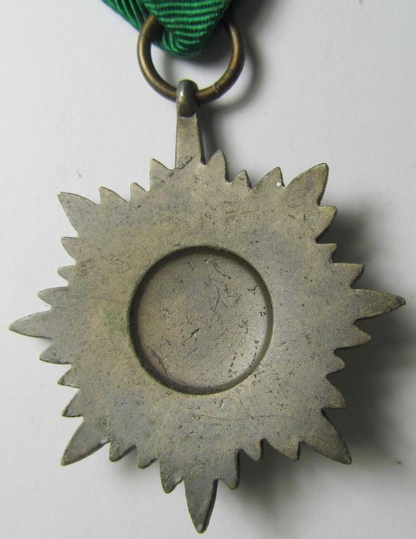 Superb, WH-related so-called: 'Tapferkeitsauszeichnung für Angehörige der Ostvölker, 3. Klasse in Bronze mit Schwertern' (being a non-maker-marked- and/or: 'Feinzink'-based example that comes mounted onto its period ribbon)