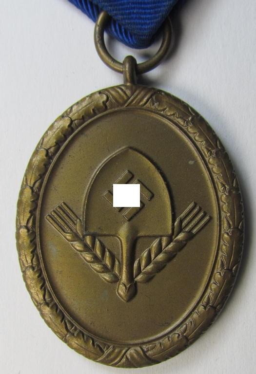 Attractive example of a: RAD (ie. 'Reichsarbeitsdienst') so-called: 'Dienstauszeichnung 4. Stufe für Männer' as was intended for 4 years loyal-service and that comes mounted onto its period piece of ribbon (ie. 'Bandabschnitt')