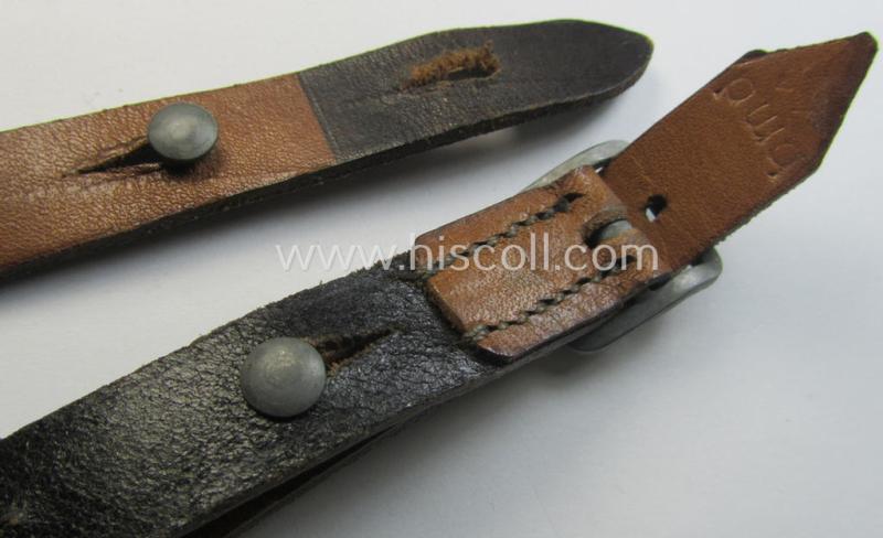 Early-war-period- and 'standard-issue'-pattern, black-coloured- and/or leather-based WH helmet-strap (ie. 'Riemen für Stahlhelm') being an: 'BMD 41'-marked example that comes in a never mounted ie. 'virtually mint' condition