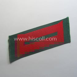 Regrettably single, (entirely!) 'BeVo'-woven, EM-pattern 'Ostvölker'-collar-tab as as...