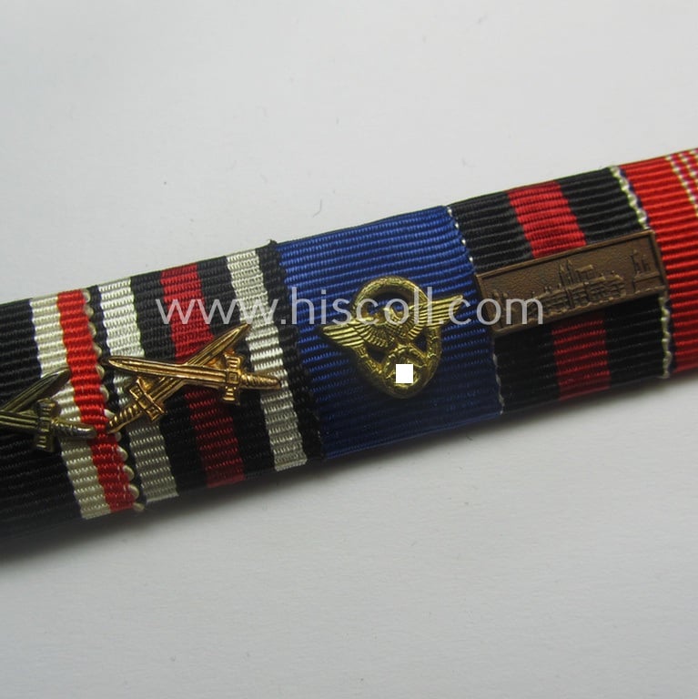 7-pieced, WWI- (ie. WWII-) period (ie. 'Polizei'-related) ribbon-bar (ie. 'Feld- o. Bandspange') showing (amongst others) an 'EKII.Kl.', a: 'FKK m. S.', a: 'Pol.-DA 1. Stf.', a: 'Deu. Olympia-.E. medal 1936' and an Austrian, WWI-commemorative-medal