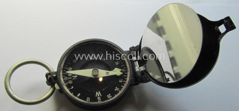 Superb, 'standard-issue'-pattern, black-coloured and/or copper-based WH-compass (ie. 'Marschkompass') which is nicely 'MK'-marked and/or individually numbered: '27854' and that comes mounted onto its period 'Fangschnur'