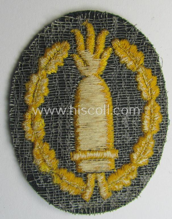 Neat, machine-embroidered, WH (Heeres) so-called: 'Richtabzeichen für Artillerie-Richtkannoniere' (or: artillery gun-layers patch) being a detailed example that comes in a never used- ie. 'virtually mint-/unissued'-, condition