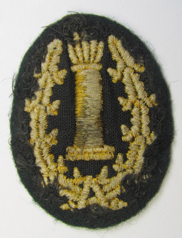 Machine-embroidered, WH (Heeres) so-called: 'Richtabzeichen für Artillerie-Richtkannoniere' (or: artillery gun-layers patch) being a detailed example that comes in a clearly used- ie. worn- and carefully tunic-removed-, condition