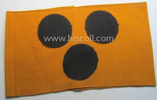 Armband (ie. 'Armbinde') depicting 3 black 'dots'  for...