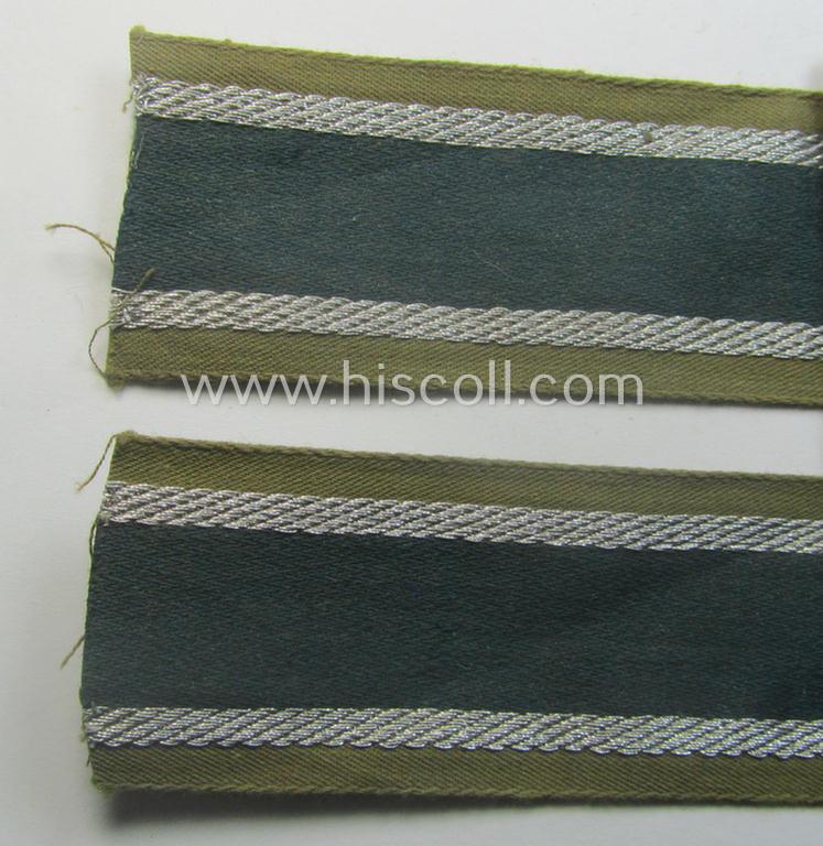 'BeVo'-like cuff-title (ie. 'Ärmelstreifen') entitled: 'Afrikakorps' being a presumably issued but simply never worn example that comes in an overall very nice- (ie. non-shortened- and never tunic-attached-), condition