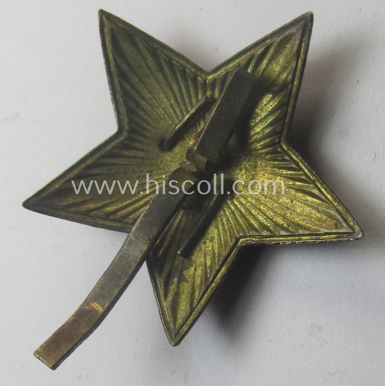Unusual item that originated from a German soldier: a Russian, larger-sized and/or WWII-period, enamelled star-shaped cap-badge showing the communist logo on a bright-red-coloured surface