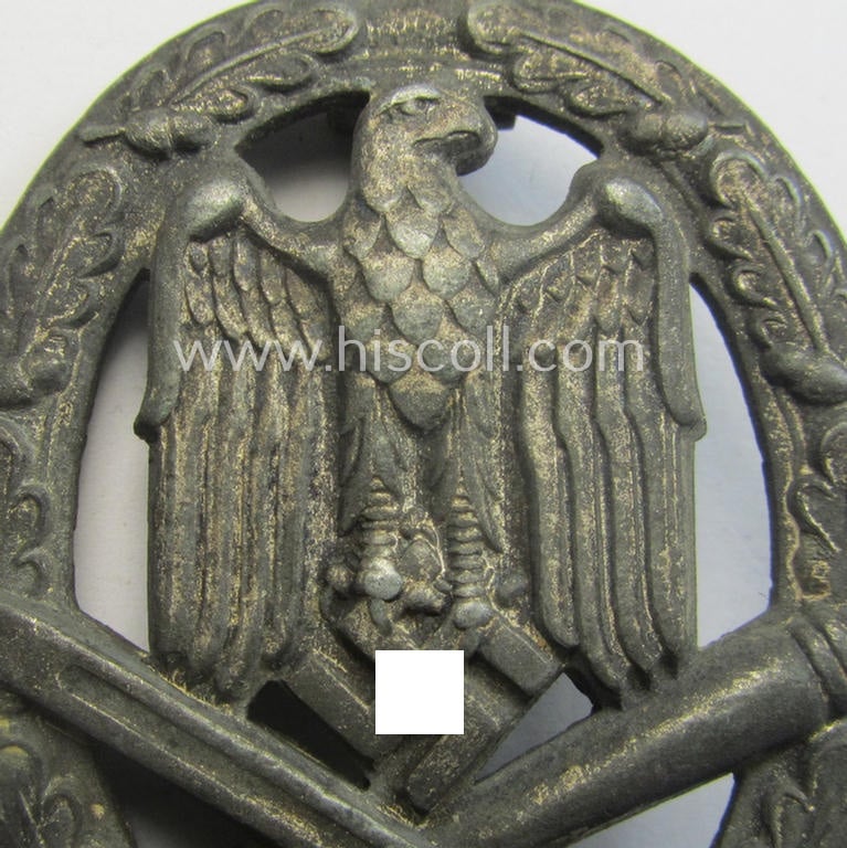 'Allgemeines Sturmabzeichen' (or: General Assault Badge ie. GAB) being a typical unmarked, zinc-based- (ie. 'Feinzink'-) and/or: 'flat-back'-version as was (I deem) produced by the: 'Rudolf Karneth'-company