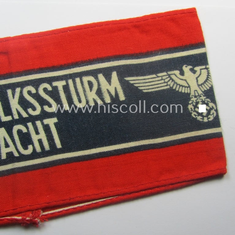 Typically printed- and/or later-war-period, bright-red- and/or black-coloured so-called: 'Deutscher Volkssturm'-armband (ie. 'Armbinde') that comes in an overall very nice- (I deem hardly used- nor worn- ie. 'virtually mint'-), condition