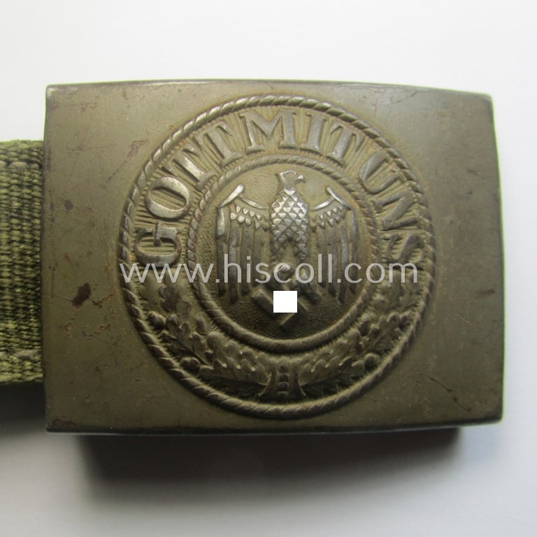 WH (Heeres) 'tropical-issued' belt-buckle being a non-maker-marked, field-grey-coloured example that comes mounted onto its original, greenish-coloured- (and/or: 'webbing'-based-) tab