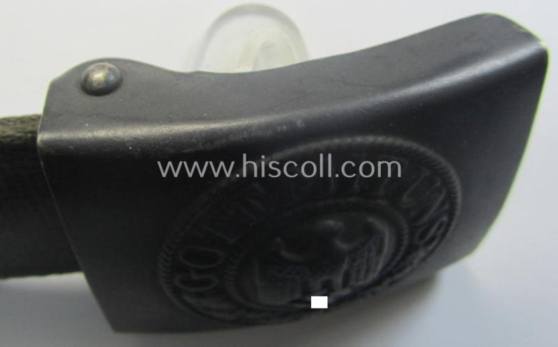 WH (Heeres) 'tropical-issued' belt-buckle being a non-maker-marked (and/or period re-sprayed!) bluish-coloured example that comes mounted onto its original, greenish-coloured- (and/or: 'webbing'-based-) tab