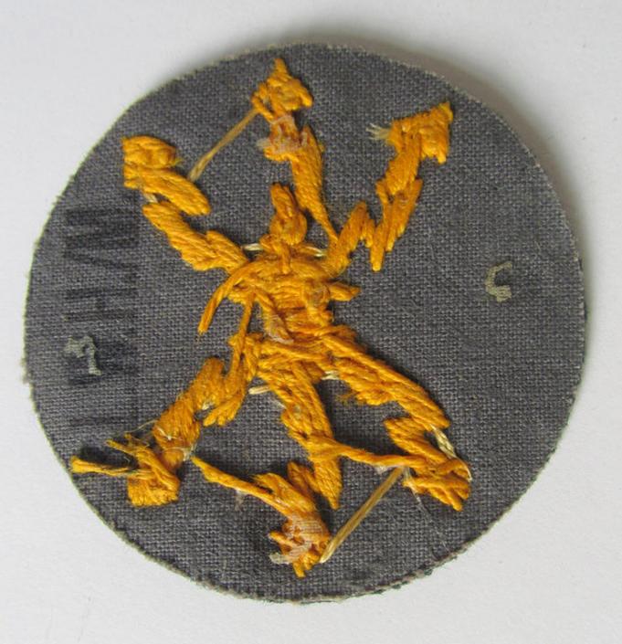 Attractive, WH (Heeres) so-called: trade- and/or special career arm-insignia, as was intended for a: 'Funkmeister', being a neatly hand-embroidered variant on darker-green-coloured wool