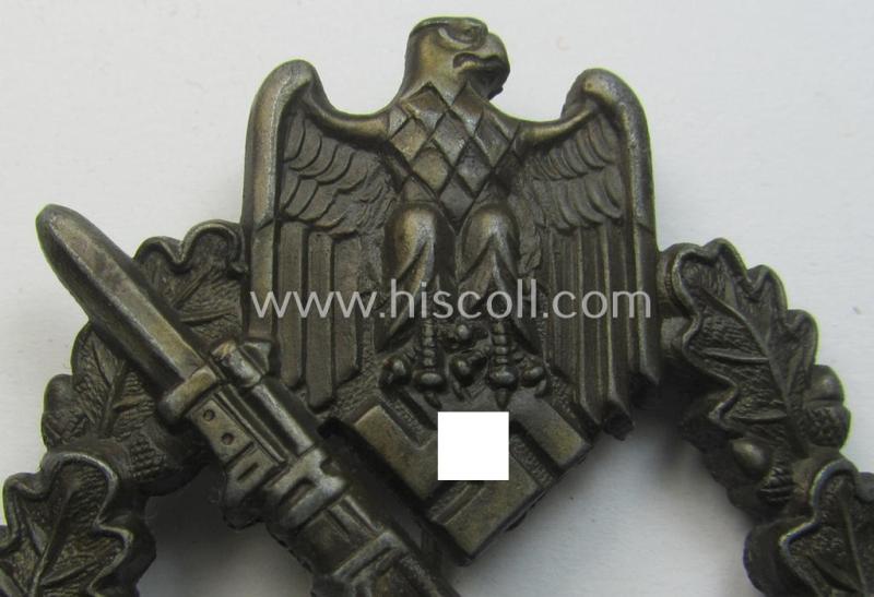 'Infanterie Sturmabzeichen in Bronze' (or: bronze-class infantry assault-badge ie. IAB) being a maker- (ie. 'AS'- ie. 'Adolf Scholze') marked so-called: 'solid-back'-example as was executed in zinc-based metal