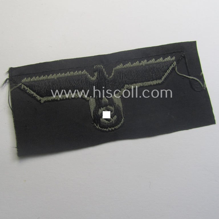 WH (Heeres) later- (ie. mid-war-) period- and/or bluish-grey-coloured 'Panzer'-type side-cap-eagle a executed in the neat 'BeVo'-weave pattern onto a typical black-coloured background