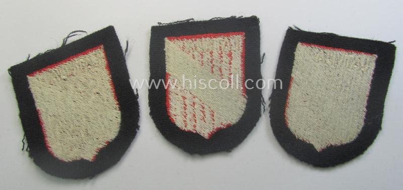 Latvian, Waffen-SS 'volunteer' arm-shield as was specifically intended for usage by soldiers of the: '15. o. 19. Waffen-Grenadier-Division der SS' (ie. 'lettische nr. 1 o. 2') that comes in a 'virtually mint- ie. unissued', condition