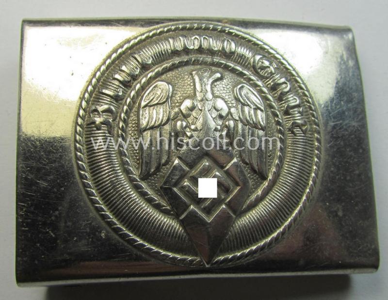 Attractive, HJ (ie. 'Hitlerjugend') bright-silver-coloured- (ie. nickle-chrome-based and early-pattern) belt-buckle being a neatly maker- (ie. 'RzM M4/44'-) marked example that comes in a just moderately used- ie. worn, condition