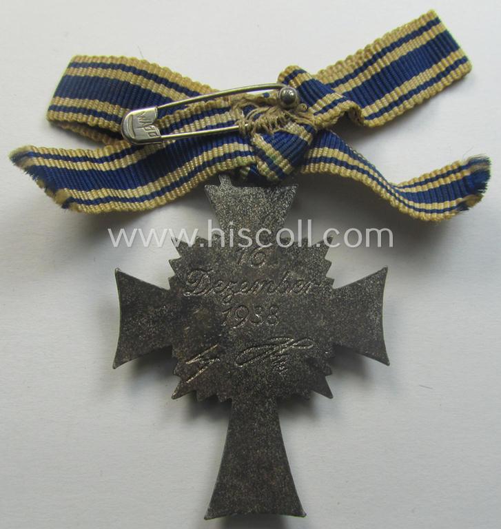 'Ehrenkreuz der deutschen Mutter - zweite Stufe' (or: silver-class mothers'-cross) that came mounted onto its (unusally seen!) 'bow-shaped' ribbon as issued and recently found