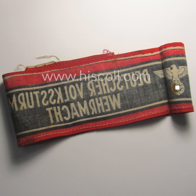 Moderately worn example of a (typically printed- and/or later-war-period) bright-red- and/or black-coloured so-called: 'Deutscher Volkssturm'-armband (ie. 'Armbinde') that comes in an overall nice condition