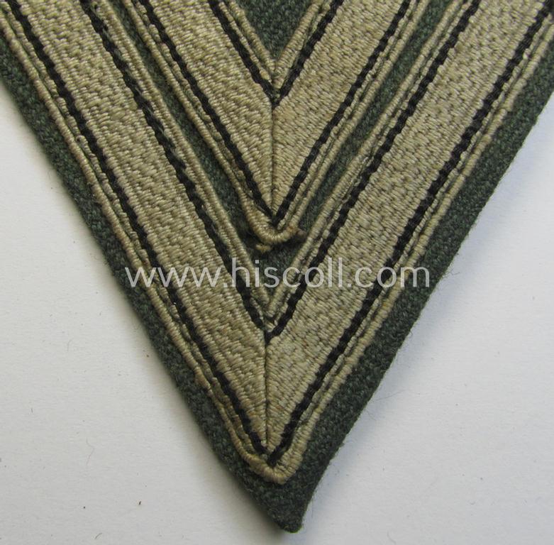 Attractive, WH (Heeres ie. Waffen-SS) 'Armwinkel' (or: arm-chevron) as was executed on a greenish-coloured- and/or 'HBT'-like (ie. 'Drillich'-) based background as was specifically intended for an: 'Obergefreiter' (ie. 'SS-Rottenführer')