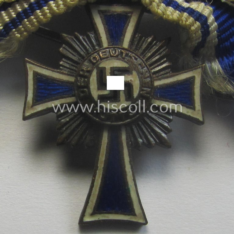 Miniature of an: 'Ehrenkreuz der deutschen Mutter - dritte Stufe' (or: bronze-class mothers'-cross) being a (typical) non-maker-marked example