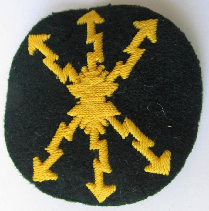 Attractive, WH (Heeres) so-called: trade- and/or special career arm-insignia, as was intended for a: 'Funkmeister', being a neatly hand-embroidered variant on darker-green-coloured wool