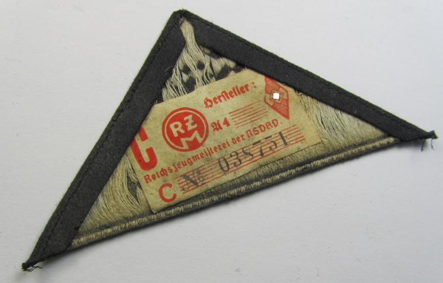 'HJ' ('Hitlerjugend') ie. 'BDM' ('Bund Deutscher Mädel') district-triangle (ie. 'Gebietsdreieck') being an example that still shows its period-attached 'RzM-etiket' entitled: 'Süd Baden'