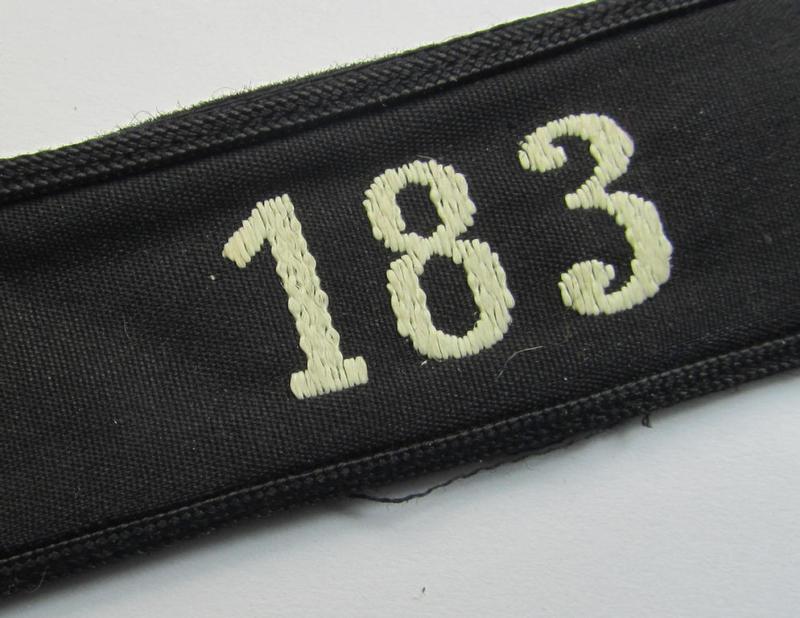 Neat - and naturally single! - black-piped 'DJ- o. Deutsches Jungvolk' shoulderstrap as was intended for usage by a: 'DJ-Mitglied' who served within the: 'Bann 183' (183 = 'Herford') and that comes with its period-attached 'RzM'-etiket