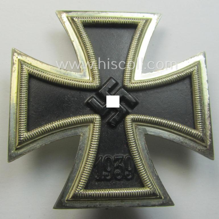 'Eisernes Kreuz 1. Klasse' (ie. Iron Cross 1st class) being an (I deem) early-war-period produced- and '26'-marked (ie. by: 'B.H. Mayer's Kunstprägeanstalt'-produced) example and that comes complete in its specific etui