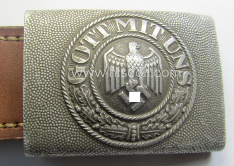 WH (Heeres) 'standard-pattern', field-grey-toned- and aluminium-based belt-buckle being a maker- (ie. 'Jul. Kremp'-) marked- and/or: '1939'-dated example that comes mounted onto its leather-based tab