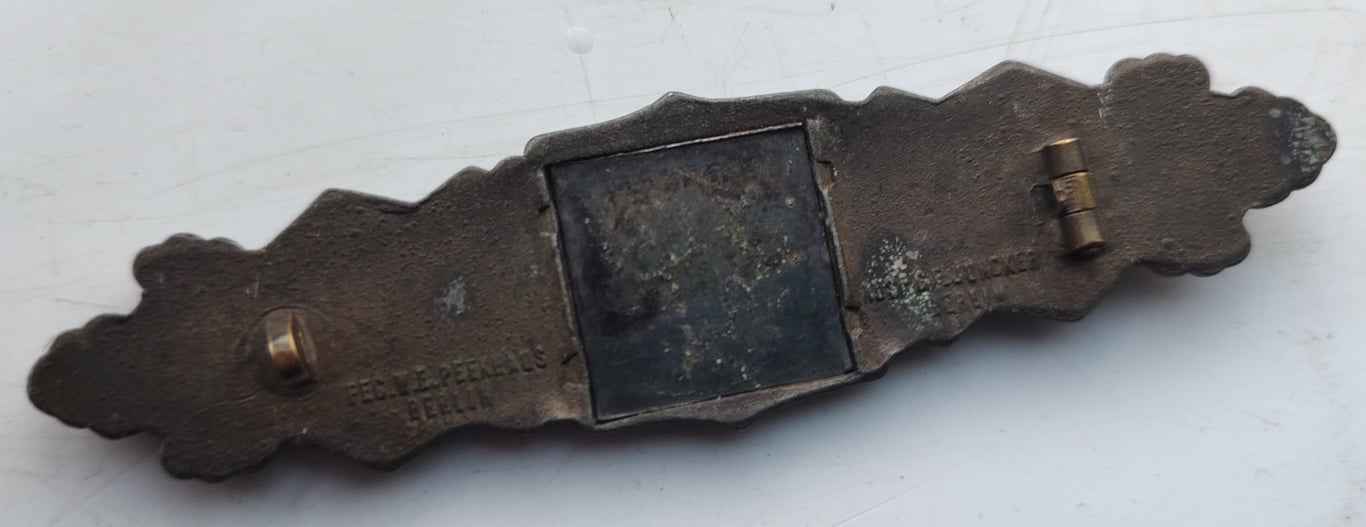 A  Nahkampfspange (Close Combat Clasp) in Bronze Grade, manufactured by C.E Juncker of Berlin