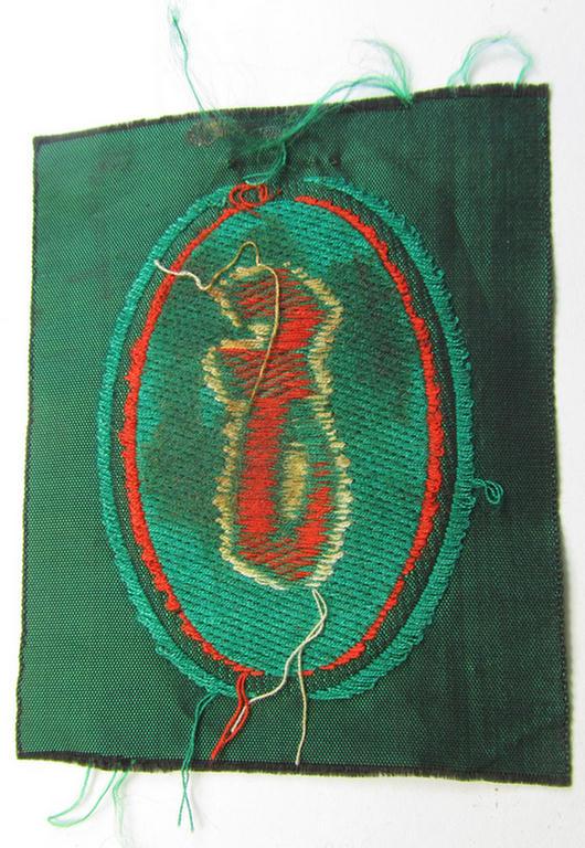 Attractive, 'Sicherheits- u. Hilfsdienst (SHD)' armbadge (ie. 'Ärmelabzeichen') as executed in 'BeVo'-weave pattern, as was intended for an SHD-member who served within the: 'Feuerlöschdienst' (or: fire-extinction service)