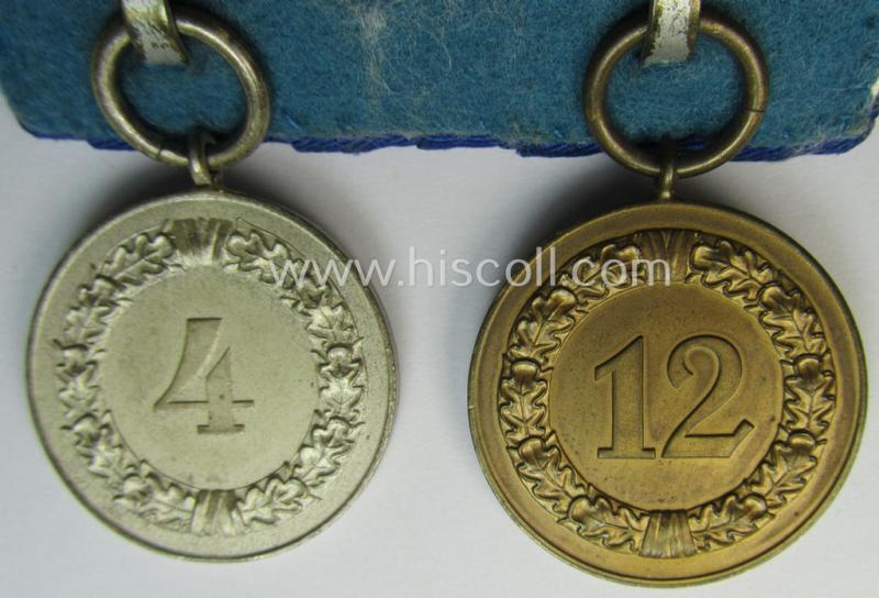 2-pieced medal-bar (ie. 'Spange') showing two: WH (Heeres o. Kriegsmarine) so-called: 'Dienstauszeichnungen für 4 u. 12 Jahre Treue Dienste' that both come period-mounted as a so-called: 'Doppelspange'