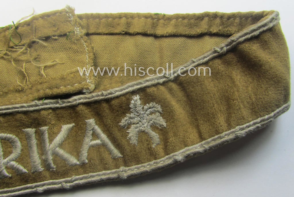 Cleary worn WH cuff-title (ie. 'Ärmelstreifen') entitled: 'Afrika' (being a minimally shortened example that comes in an overall very nice- (ie. issued and clearly worn ie. once tunic-attached-), condition