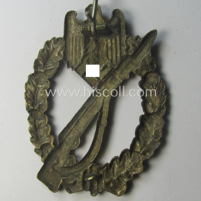 'Infanterie Sturmabzeichen in Silber' (or: silver-class infantry-assault-badge ie. IAB) being a 'Buntmetall'-based example by the: 'Otto Schickle'-company