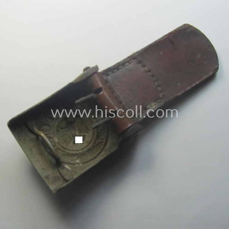 'Virtually mint', 'standard-issue'-pattern, WH (Heeres) field-grey-toned- and/or steel-based belt-buckle being a non-maker-marked example that comes mounted onto its 'B. Haarmann'-marked and/or '1941'-dated tab