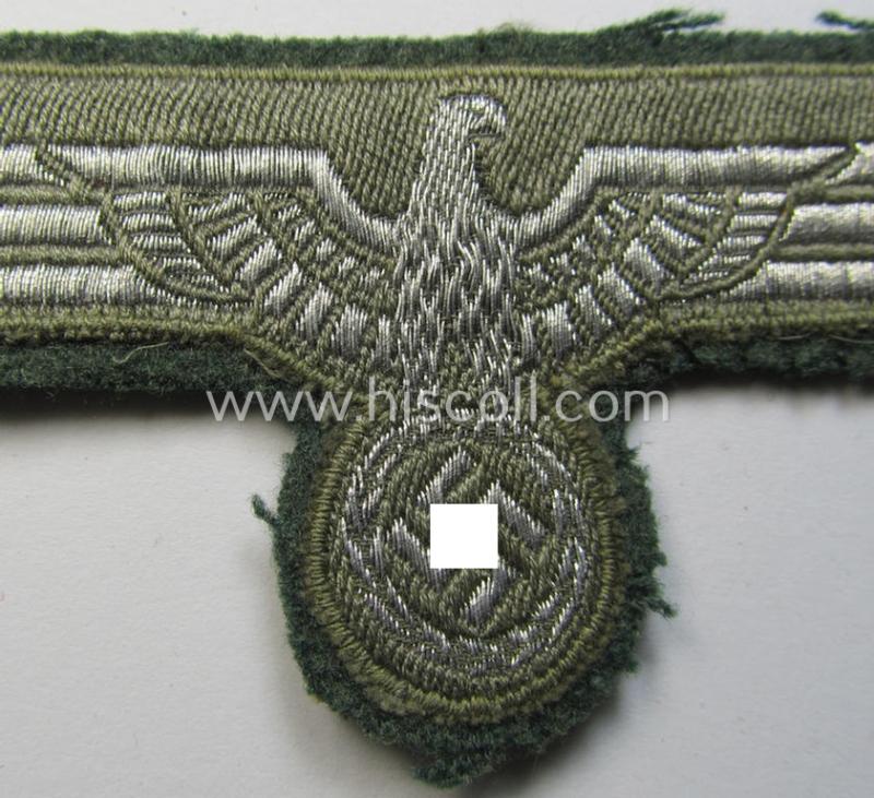 WH (Heeres) breast-eagle as executed in 'BeVo'-type-, so-called: 'flat-wire'-weave-pattern and pre-mounted on field-grey-coloured wool as was specifically intended for usage by soldiers (ie. NCOs) on their dress-tunics (ie. 'Waffenröcke')