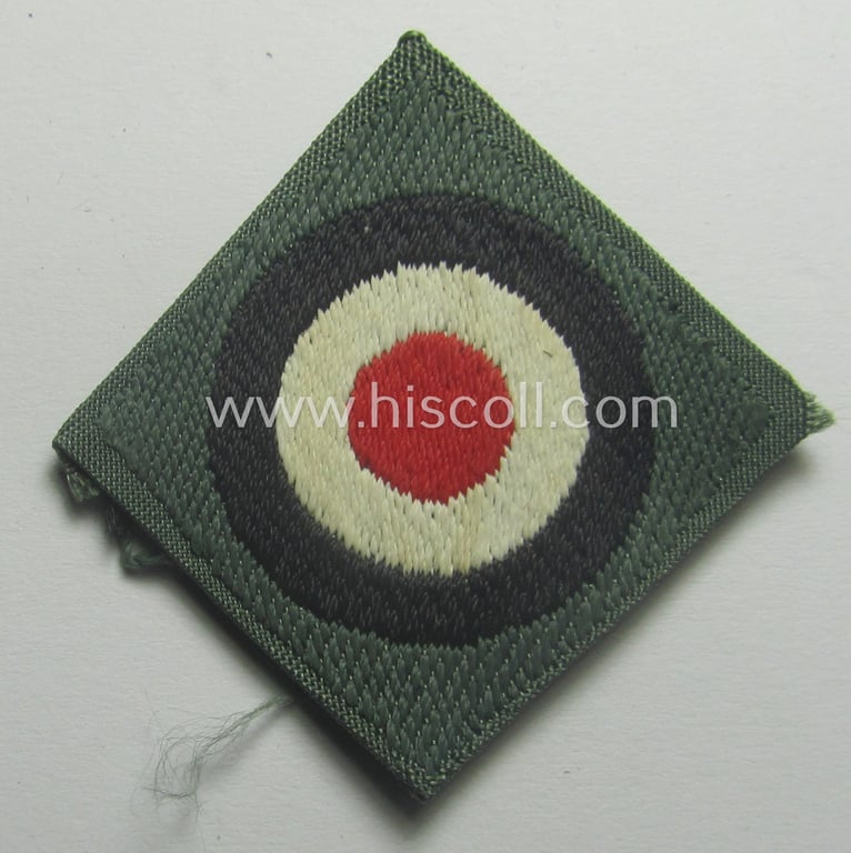Early- (ie. mid-) war-period, WH (Heeres) cap-eagle & cocarde-set (ie. 'Schiffchenmützen-Adler u. Kokarde-Satz für Mannschaften u. Uffz.') being a 'virtually mint' set as executed in bluish-grey-coloured linnen on a field-grey-coloured background