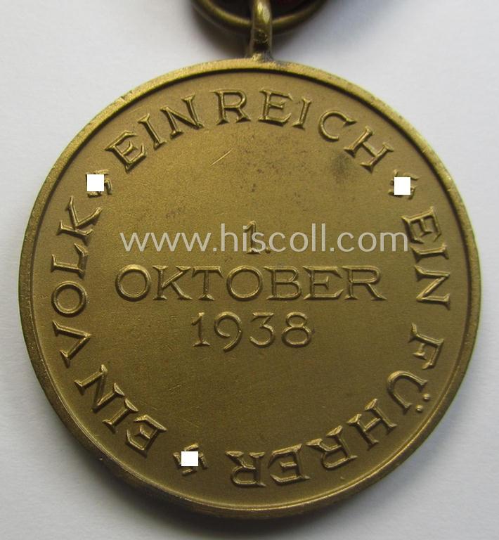 WH Czech-occupation- (ie. 'Anschluss'-) medal: '1. Oktober 1938' being a neat (albeit minimally tarnished) example that comes mounted onto its period ribbon and that shows a firmly (and period!) attached 'Prager Burg-Spange'