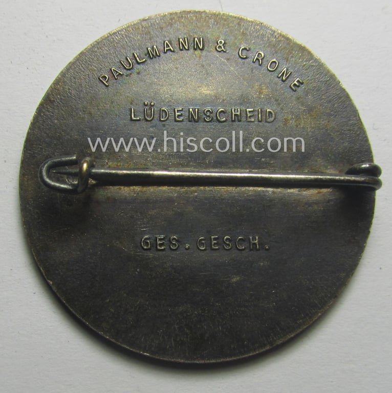 Commemorative, N.S.D.A.P.- (ie. WHW-) related 'tinnie' being a maker- (ie. 'Paulmann u. Crone'-) marked example depicting a portrait of Adolf Hitler surrounded by the text: 'Hitlers' Dank - Gau Westfalen-Nord - 1933-1934'