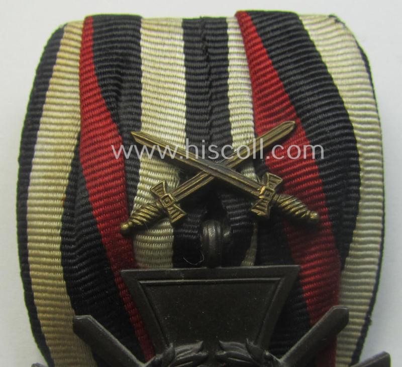 Golden-bronze-toned, so-called: 'Einzelspange' showing a: 'Frontkämpferkreuz 1914-18 mit Schwertern' (ie.: 'Kriegsteilnehmerkreuz 1914-18 mit Schw.') being a detailed- and/or zinc- ie. 'Feinzink'-based, specimen