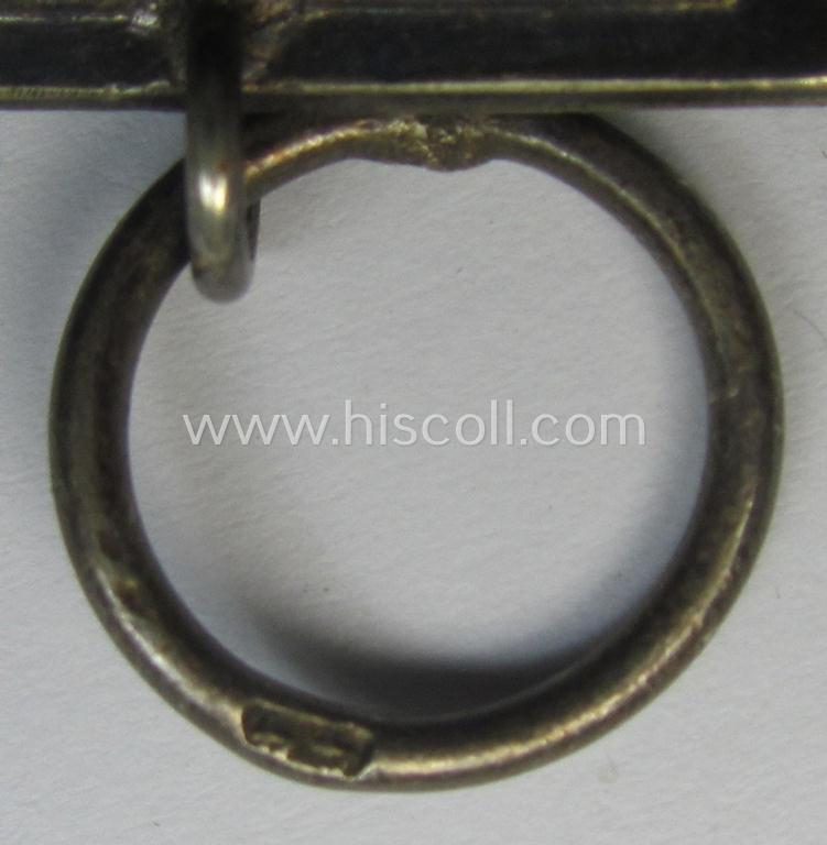 'Eisernes Kreuz II. Klasse' being a maker- (ie. '44'-) marked example that comes together with its (mint- and full length) ribbon (ie. 'Bandabschnitt') as was produced by the maker (ie. 'Hersteller'): 'Jakob Bengel - Oberstein'