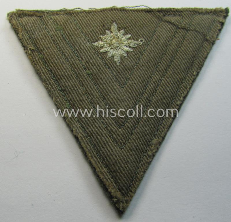 Attractive, WH (Heeres) 'Armwinkel' (or: arm-chevron) as executed on typical field-grey-coloured wool as was specifically intended for usage by a soldier with the (unusually encountered!) rank of: 'Stabsgefreiter'