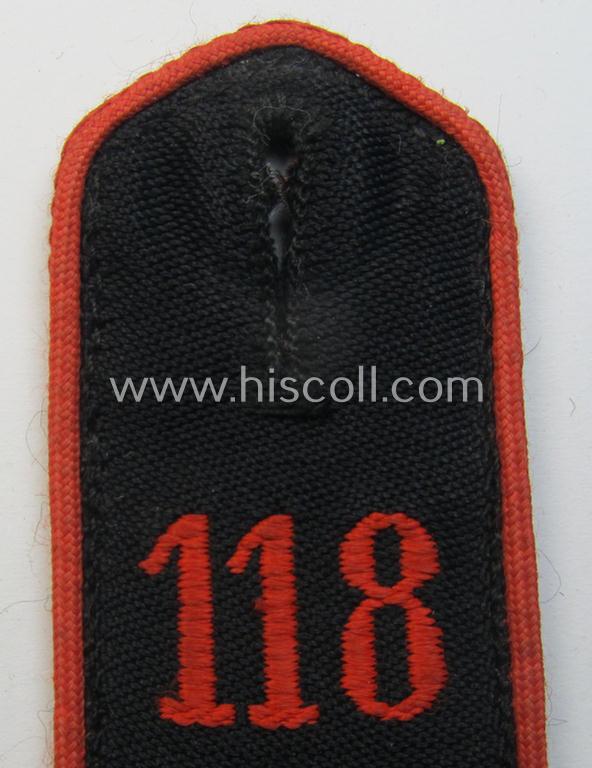 Single - and just moderately worn - bright-red-piped so-called: 'Allgemeine-HJ'-shoulderstrap as intended for a: 'HJ-Junge' who served within the 'Bann 118' (118 = 'Bann Worms' situated in the 'Gebiet West Hessen-Nassau')
