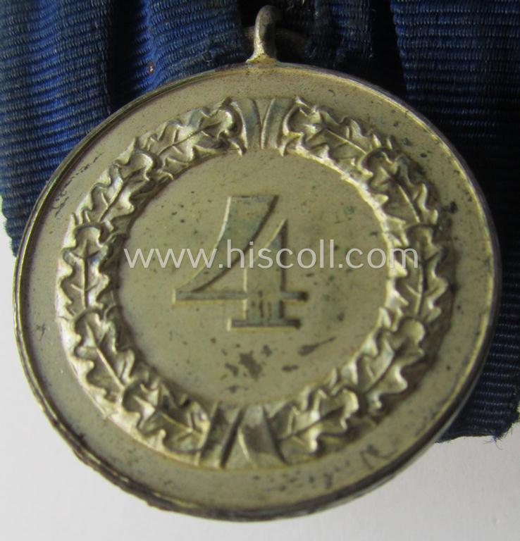 Tarnished silver-toned WH (Luftwaffe) so-called: 'Einzelspange' showing a: 'WH-Dienstauszeichnung 4. Stufe' (as was intended for 4 years of loyal-service) and that shows a detailed, Luftwaffe-type-eagle-device, period-attached