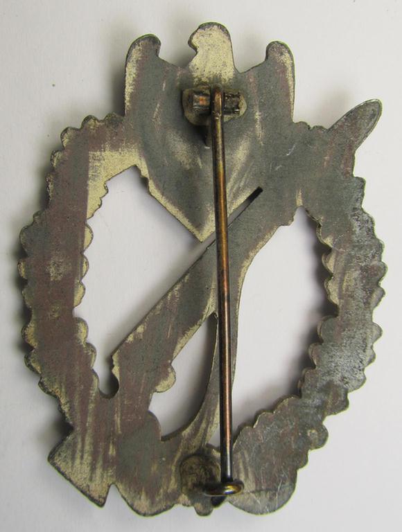 'Infanterie Sturmabzeichen in Silber' (or: silver infantry assault badge ie. IAB) as executed in zinc-based metal (ie. 'Feinzink') being a truly converse-shaped- (albeit non-maker-marked) example as was produced by the: 'Dr. Franke & Co.'-compa...