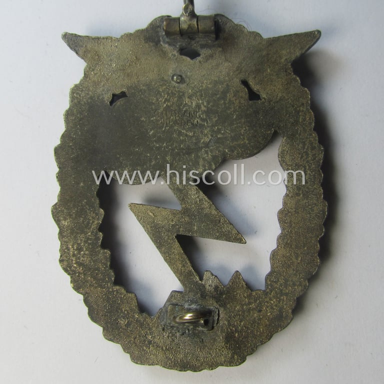 Mid- (ie. later-) war-period, zinc- (ie.'Feinzink'-) based version of a WH (Luftwaffe) 'Erdkampfabzeichen' (being a maker-marked example by the 'G.H. Osang'-company)