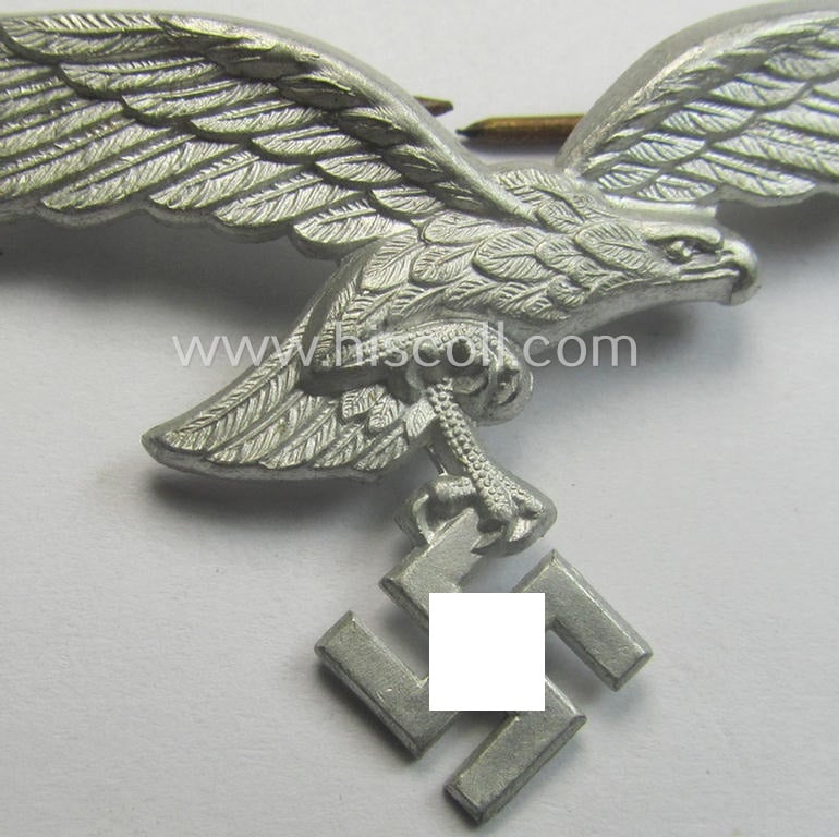 Minimally worn, WH (Luftwaffe) EM/NCO-pattern visor- (ie. 'Schirmmützen'-) cap-eagle being clearly maker- (ie. 'B.&N.-L.'-) marked example as executed in aluminium-based metal