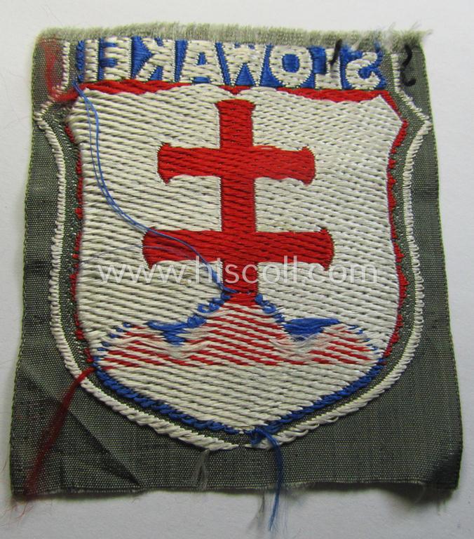 Attractive - albeit minimally damaged! - 'BeVo'-type armshield entitled: 'Slowakei' (being a piece that was intended for a volunteer who served within the: 'Deutsche Wehrmacht' ie. within the: 'Slowakisches Legion')