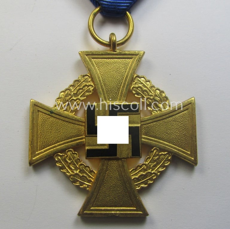 'Treuedienst Ehrenzeichen 1. Klasse' being a (typical) non-maker-marked example that came mounted onto its original ribbon (ie. 'Bandabschnitt') and that comes stored in its etui as issued