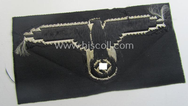 Mid- (ie. later-war-) pattern, 'SS' (ie. 'Waffen-SS') so-called: 'BeVo-weave-style', enlisted-mens'- ie. NCO-pattern arm-eagle (ie. 'Ärmeladler für Mannschaften u. Unterführer') as was intended for usage by the various Waffen-SS-troops